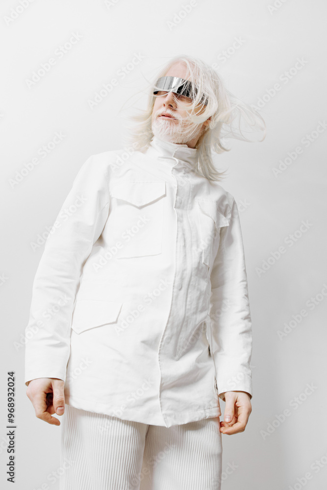 Fashionable model wearing a modern white outfit with unique sunglasses, standing against a minimalist light background, showcasing contemporary style and innovation in fashion photography Fashionable model wearing a modern white outfit with unique sunglasses, standing against a minimalist light background, showcasing contemporary style and innovation in fashion photography