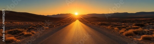 Golden sunrise illuminating a narrow road through a desolate desert, evoking feelings of solitude and hope on a new path