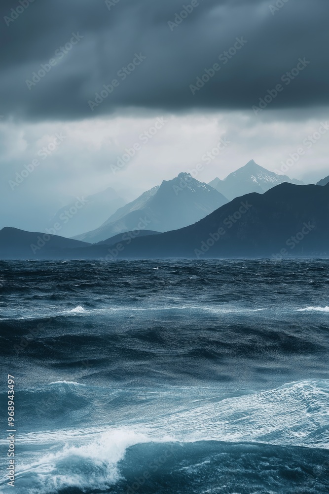 A large body of water with a stormy sky above it. The waves are crashing against the shore, creating a sense of power and energy A large body of water with a stormy sky above it. The waves are crashing against the shore, creating a sense of power and energy