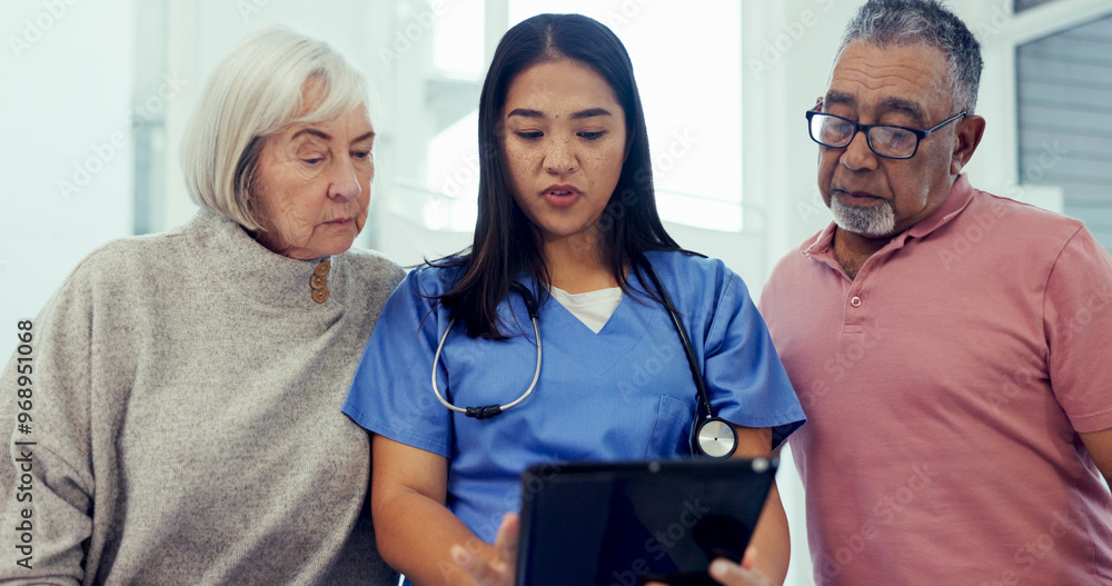 Obraz premium Nurse, elderly couple or discussion with tablet for medical result, healthcare exam or test at hospital. Female person, caregiver or health employee talking to senior patients on technology at clinic