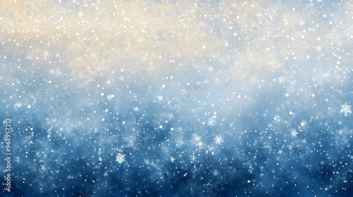 Delicate white snowflakes gently fall against a soft, blurred blue background, creating a serene winter scene. The snow-covered landscape adds a peaceful, seasonal ambiance.