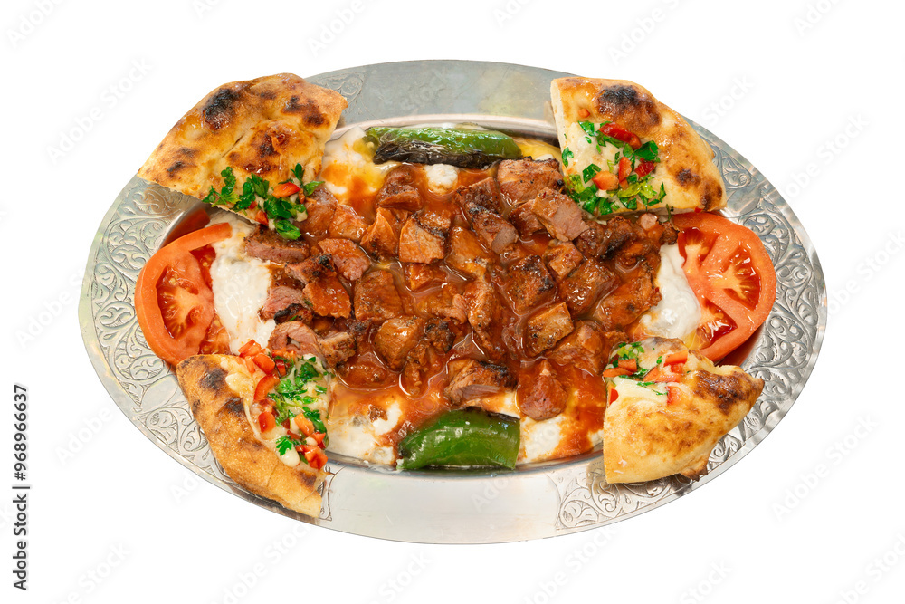 Top view Ali Nazik Kebab, Traditional Turkish Lamb Kebab with Spicy Smoked Eggplant and Yogurt on a traditional serving platter. Turkish name; Ali nazik kebab, isolated on a white background Top view Ali Nazik Kebab, Traditional Turkish Lamb Kebab with Spicy Smoked Eggplant and Yogurt on a traditional serving platter. Turkish name; Ali nazik kebab, isolated on a white background