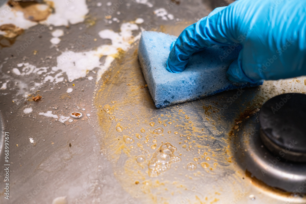 Dirty stove with food leftovers. Unclean gas kitchen cooktop with greasy spots, old fat stains, fry spots and oil splatters. Dirty stove with food leftovers. Unclean gas kitchen cooktop with greasy spots, old fat stains, fry spots and oil splatters.