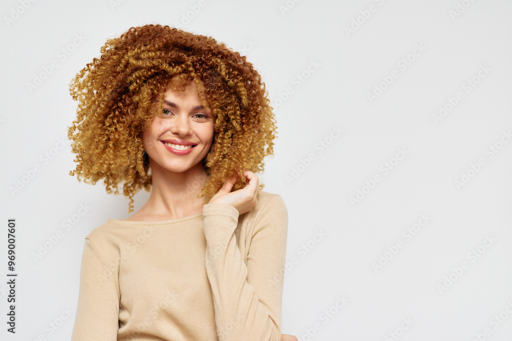 Smiling woman with curly hair on a neutral background Bright and cheerful expression, wearing a beige top, capturing a joyful and confident atmosphere ideal for lifestyle images Smiling woman with curly hair on a neutral background Bright and cheerful expression, wearing a beige top, capturing a joyful and confident atmosphere ideal for lifestyle images