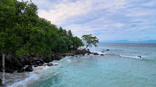 Aerial Footage of Sea Water Splashing Against Rocky Beach
