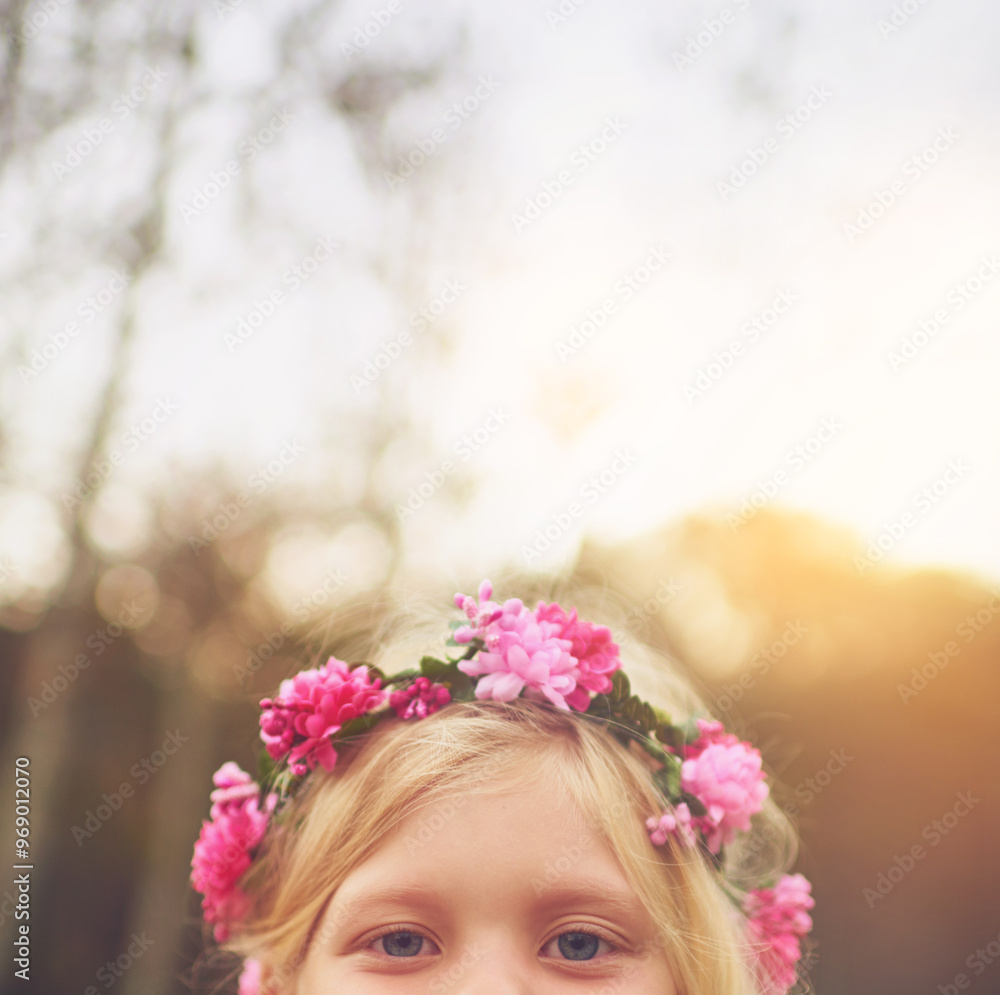 Naklejka premium Child, flower crown and eyes for fun, playful space and peekaboo games outside nature. Girl, kid and youth in hide and seek activity, backyard dress up and fairy princess costume for birthday
