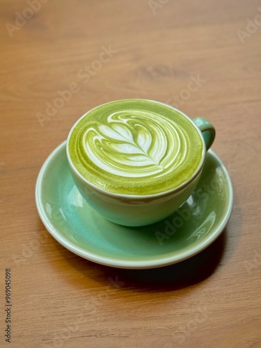 A cup of Japanese matcha latte. The beautiful latte art of hot  greentea with milk in cafe.