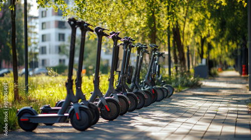 Eco-friendly transportation with a row of electric scooters and bicycles ready for city commuting, clean streets and solar-powered stations photo