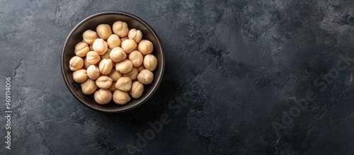 Bowl with macadamia nuts on...