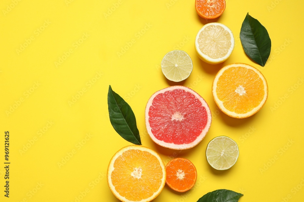 Tropical fruits on a colored background. Summer concept. Flat lay, top view, copy space Tropical fruits on a colored background. Summer concept. Flat lay, top view, copy space