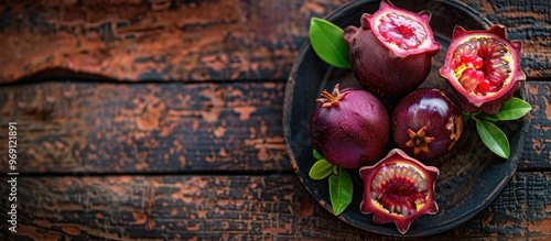 Mangosteen fruit on a woode...