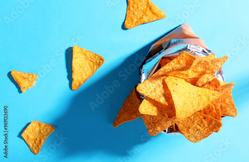 Fotografie Bag chips doritos on blue background