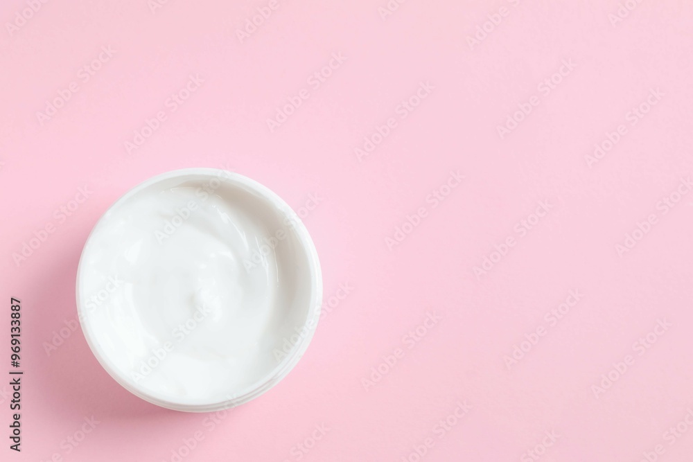 Moisturizing care skincare face cream for healing complicated troubled skin type in an open jar with visible texture Moisturizing care skincare face cream for healing complicated troubled skin type in an open jar with visible texture