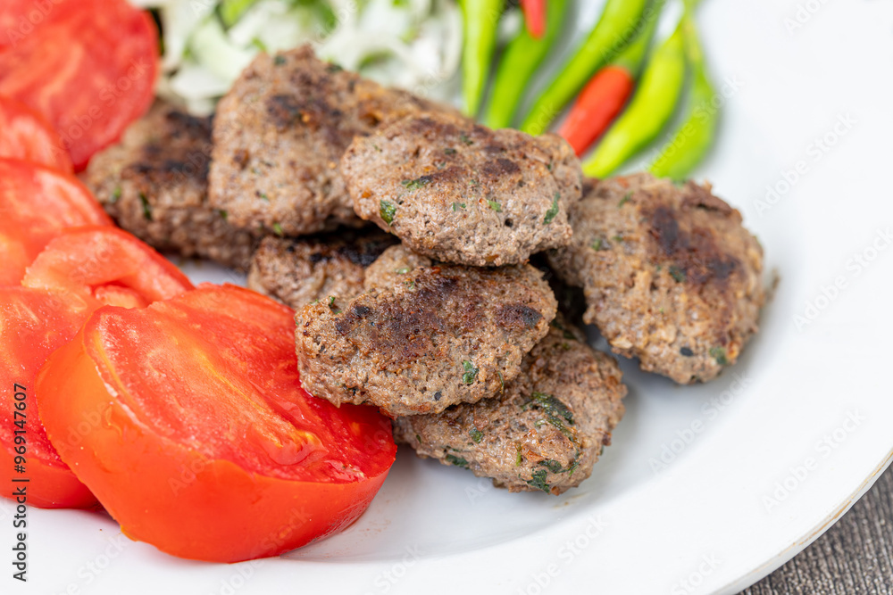 The famous Milas meatballs are made with tomatoes, onions, red and green peppers.