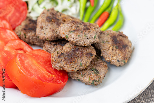 Obraz na płótnie The famous Milas meatballs are made with tomatoes, onions, red and green peppers. w salonie