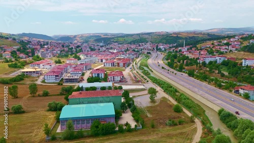 Aerial view a city with a highway. photo