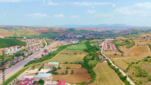 Aerial view a town with a highway. photo