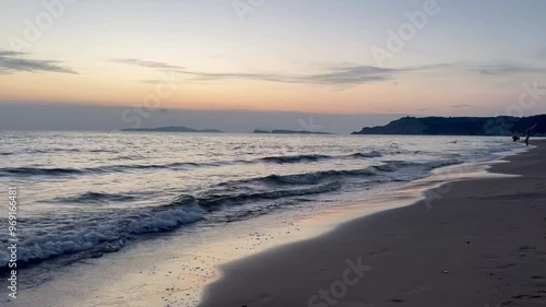 Wallpaper Mural Scenic view of waves rushing at sandy beach against sky during sunset Torontodigital.ca