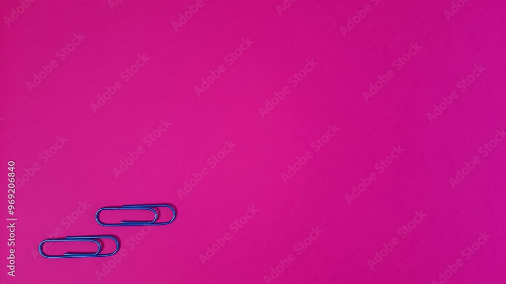 Fun animation with paper clips on a pink background. Stop motion. Step by step. Concept of teamwork, friends, walking, finding a solution, problem-solving Fun animation with paper clips on a pink background. Stop motion. Step by step. Concept of teamwork, friends, walking, finding a solution, problem-solving