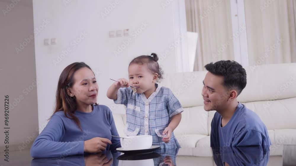 Family enjoying a joyful meal together at home in the afternoon Family enjoying a joyful meal together at home in the afternoon