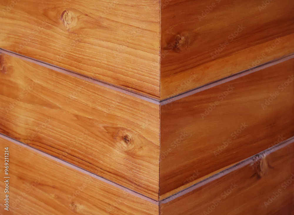 Natural colored wood panels arranged at right angles. You can clearly see the wood grain.
Natural colored wood panels arranged at right angles. You can clearly see the wood grain.