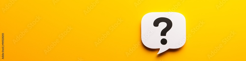 A white question mark is on a yellow background. The question mark is on a piece of paper that is on a yellow surface A white question mark is on a yellow background. The question mark is on a piece of paper that is on a yellow surface