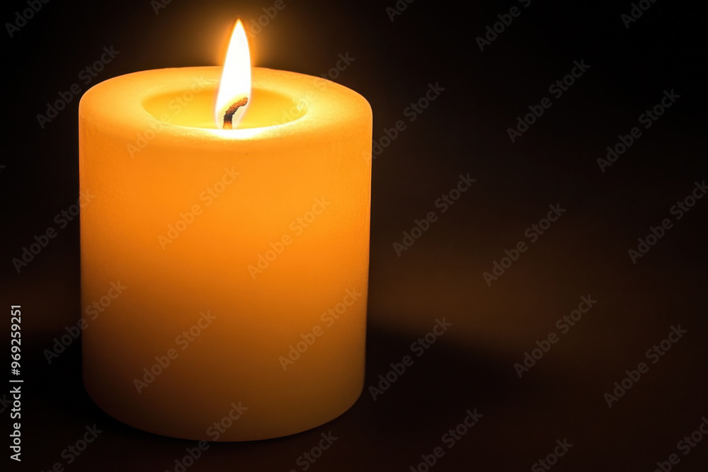A warm candle flickers softly in darkness, casting gentle glow that creates serene atmosphere. light dances, evoking feelings of calm and reflection A warm candle flickers softly in darkness, casting gentle glow that creates serene atmosphere. light dances, evoking feelings of calm and reflection