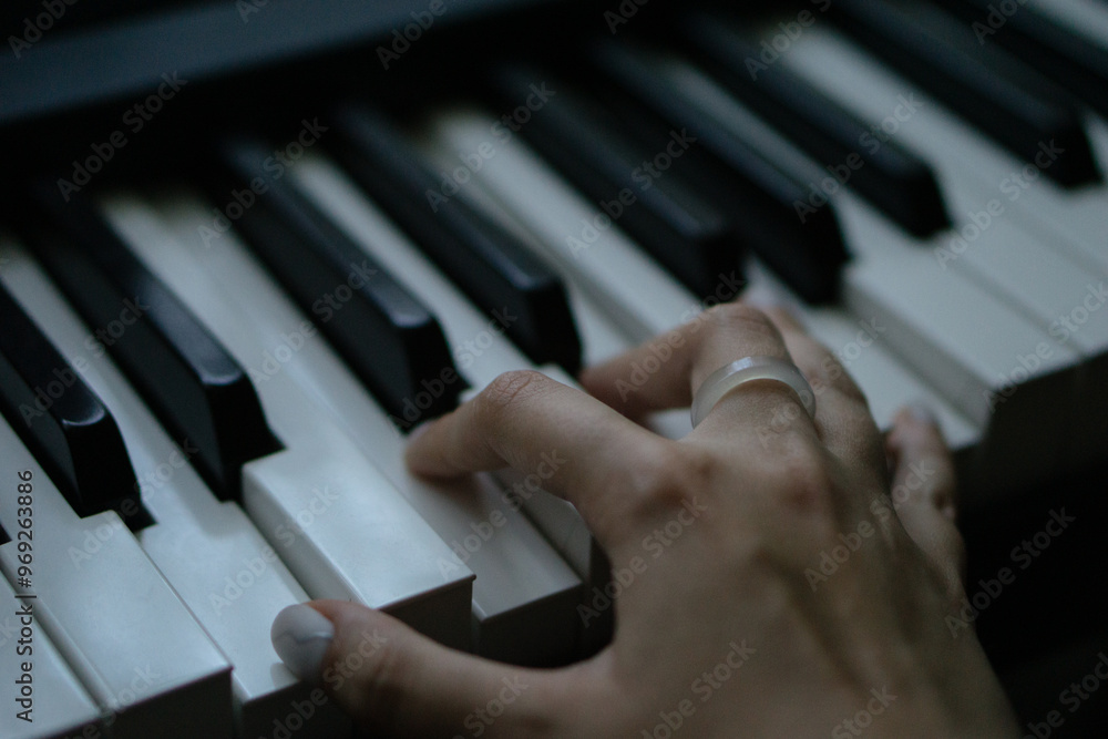 Fototapeta premium Piano keys person plays classical music black and white