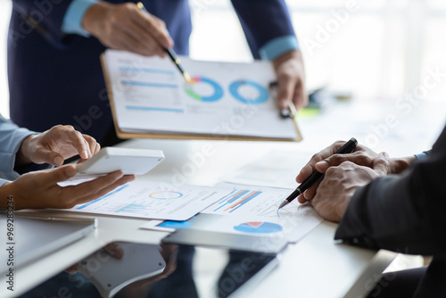 Business adviser meeting to analyze and discuss the situation on the financial report in the meeting room. Investment Consultant, Financial Consultant, Financial advisor and accounting concept. photo