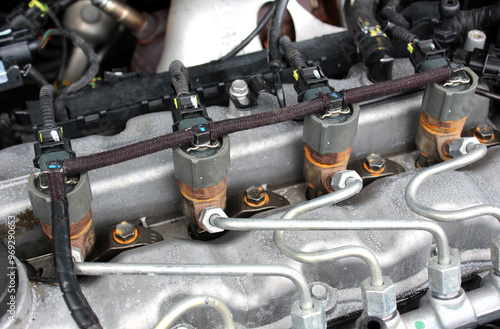 Diesel fuel injectors. Fuel system of car. Diesel engine injectors. Detail of modern common rail diesel engine repair, rail, pipeline and injectors. 