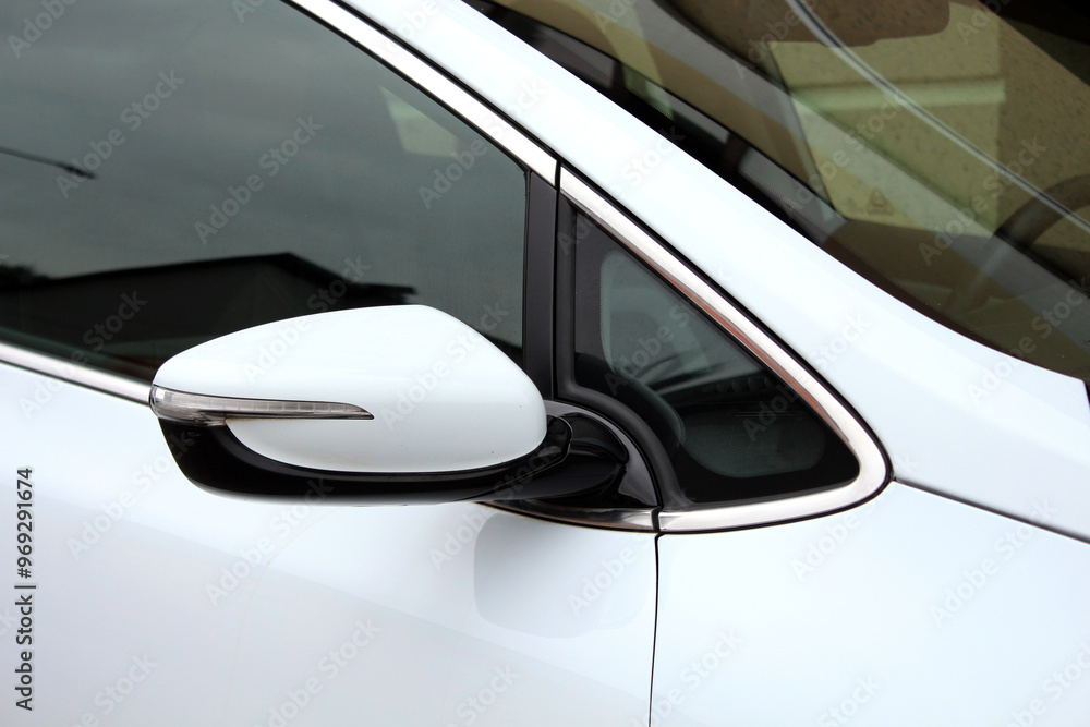 White modern car rear view mirror. Integrated turn signal in the rear view mirror. New car side mirror. Electric SUV rear view mirror. Right view. White modern car rear view mirror. Integrated turn signal in the rear view mirror. New car side mirror. Electric SUV rear view mirror. Right view.