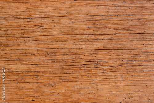 Close-up of a rustic wooden surface with a natural grain pattern and texture.