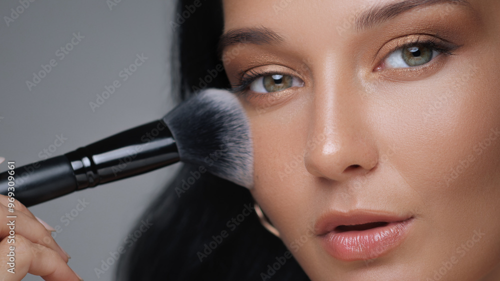 Close-Up of Woman Applying Makeup with Soft Brush for Flawless Finish Close-Up of Woman Applying Makeup with Soft Brush for Flawless Finish