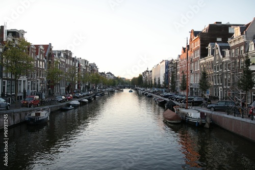 Scenic Amsterdam canal with historic buildings and boats