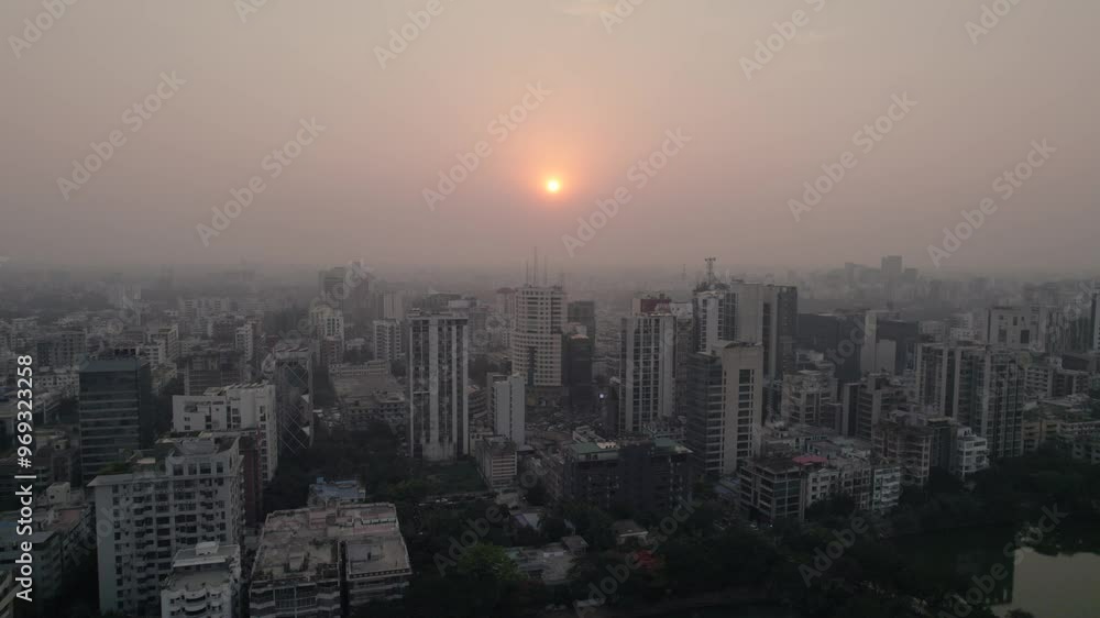 Drone view of Dhaka cityscape at sunset with a foggy sky in Bangladesh Drone view of Dhaka cityscape at sunset with a foggy sky in Bangladesh