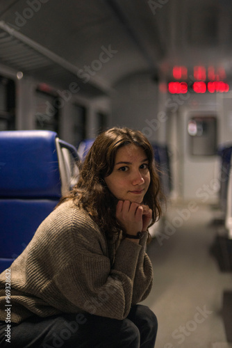 A woman sitting on a train 