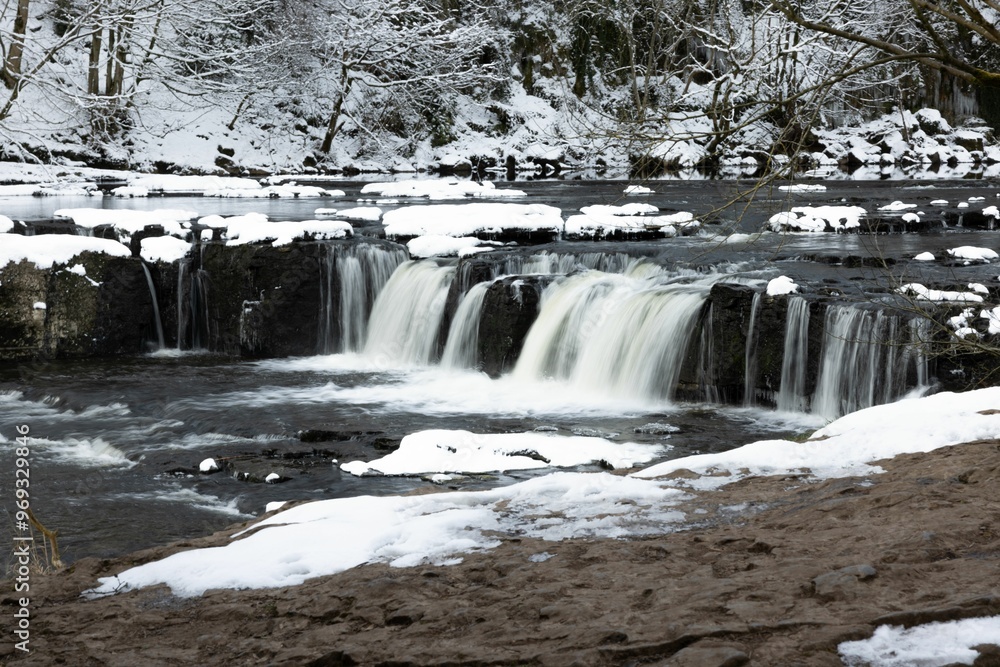 Winter Waterfall with Snow-Covered Surroundings Winter Waterfall with Snow-Covered Surroundings