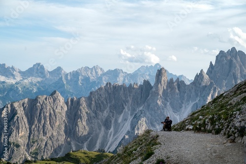Canvas Print Hiker on a trail in the Dolomite mountains