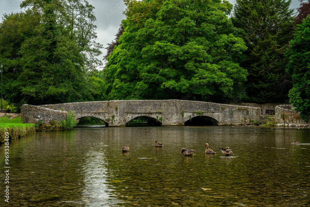 Ashford in the Water medieval three arch sheep wash bridge in the Peak District National Park. Ashford in the Water medieval three arch sheep wash bridge in the Peak District National Park.