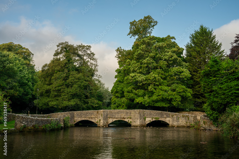 Ashford in the Water medieval three arch sheep wash bridge in the Peak District National Park. Ashford in the Water medieval three arch sheep wash bridge in the Peak District National Park.