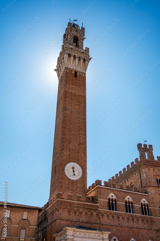 Fototapeta premium Torre del Mangia in Siena under a clear blue sky