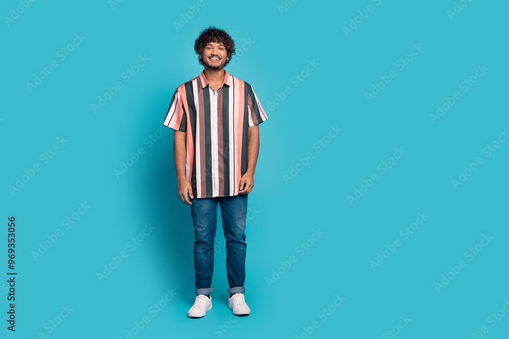 Full size photo of nice young man posing empty space wear shirt isolated on teal color background Full size photo of nice young man posing empty space wear shirt isolated on teal color background