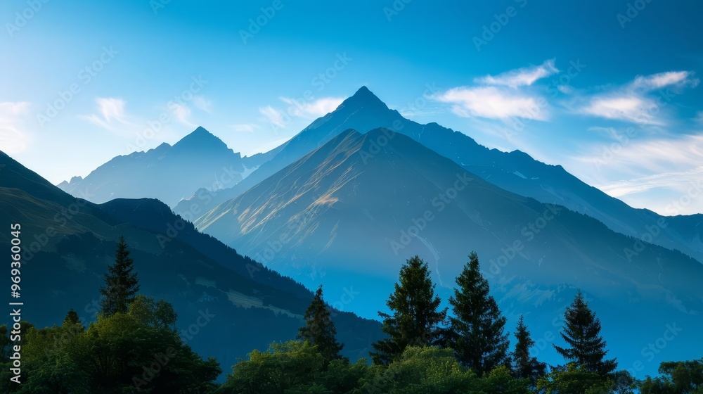 Majestic mountain range with lush greenery under a clear blue sky. Majestic mountain range with lush greenery under a clear blue sky.