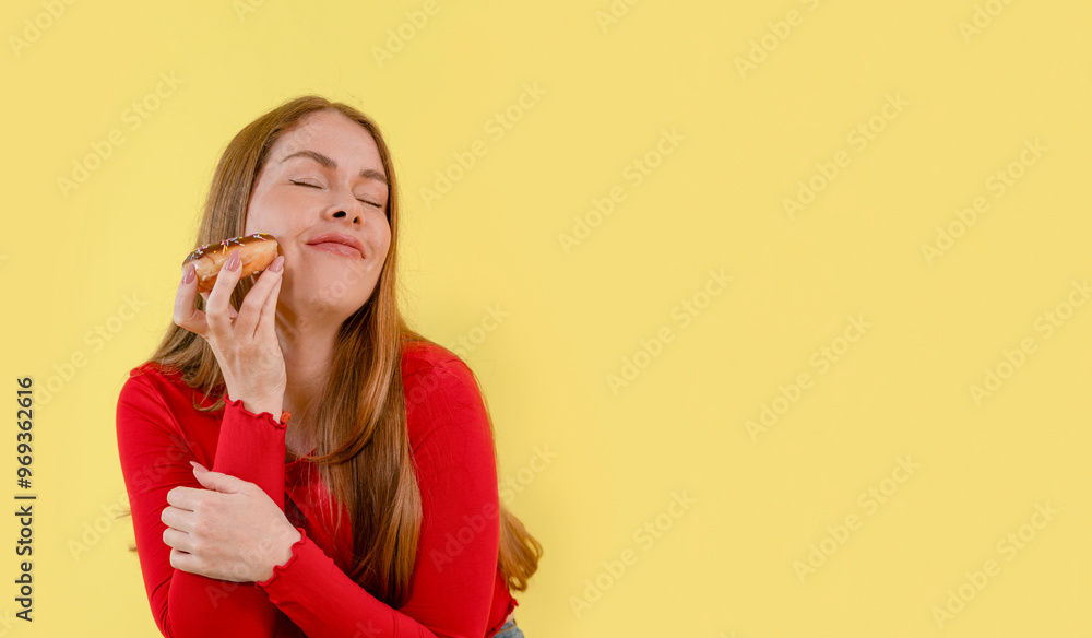 Joyful Young Woman Savoring Delicious Pastry Against Cheerful Yellow Backdrop Joyful Young Woman Savoring Delicious Pastry Against Cheerful Yellow Backdrop