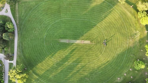 Top down drone footage of Waterloo Park Cricket Pitch on a sunny day in Waterloo, Ontario, Canada photo