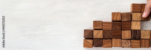 Wooden blocks arranged in a pattern on a white background. photo