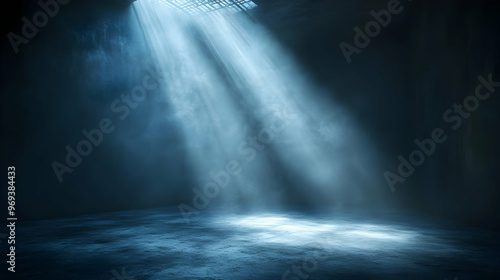 A dimly lit space with beams of light illuminating a darkened area.