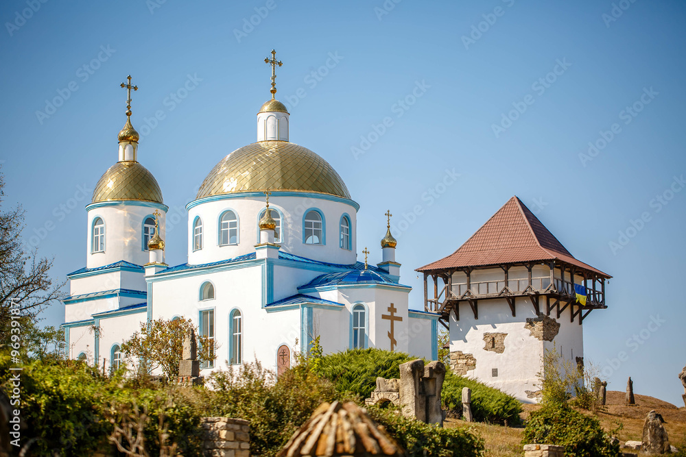 Blue Church and Old Tower in an open air nature reserve. Busha village. Ukraine