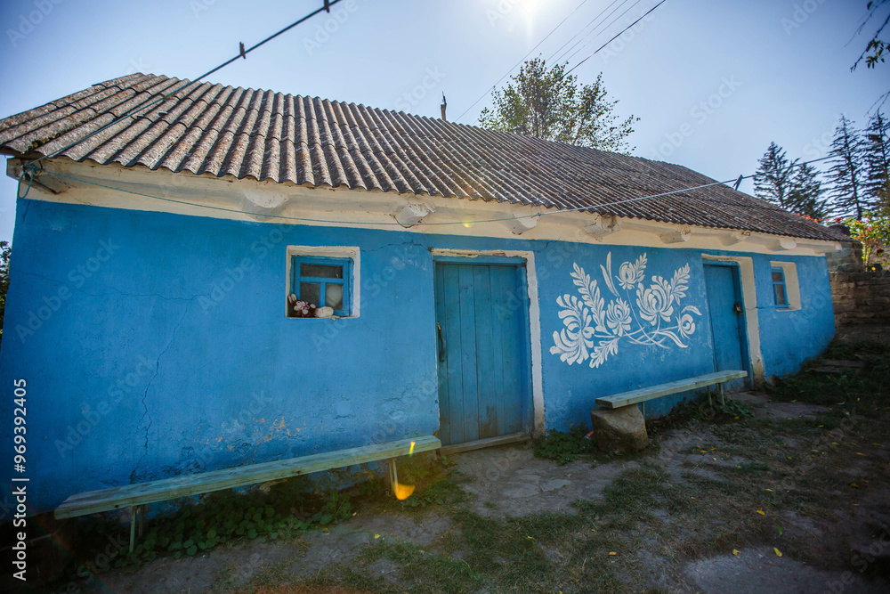 Ukrainian house painted with floral patterns in ancient technique