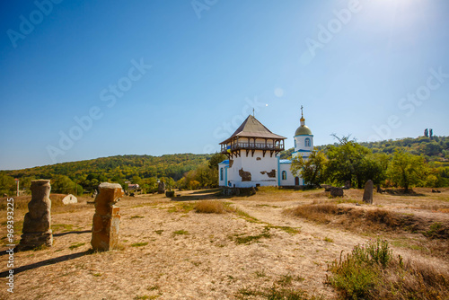 Obraz na płótnie Blue Church and Old Tower in an open air nature reserve. Bush village. Ukraine w salonie